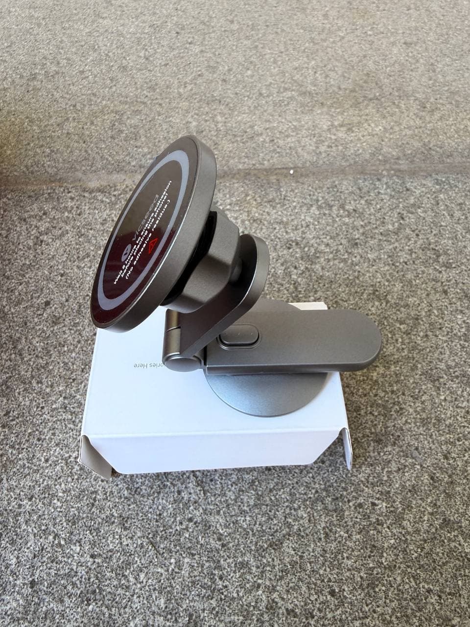 Side close-up of the VICSEED Tesla phone mount showing hinge structure