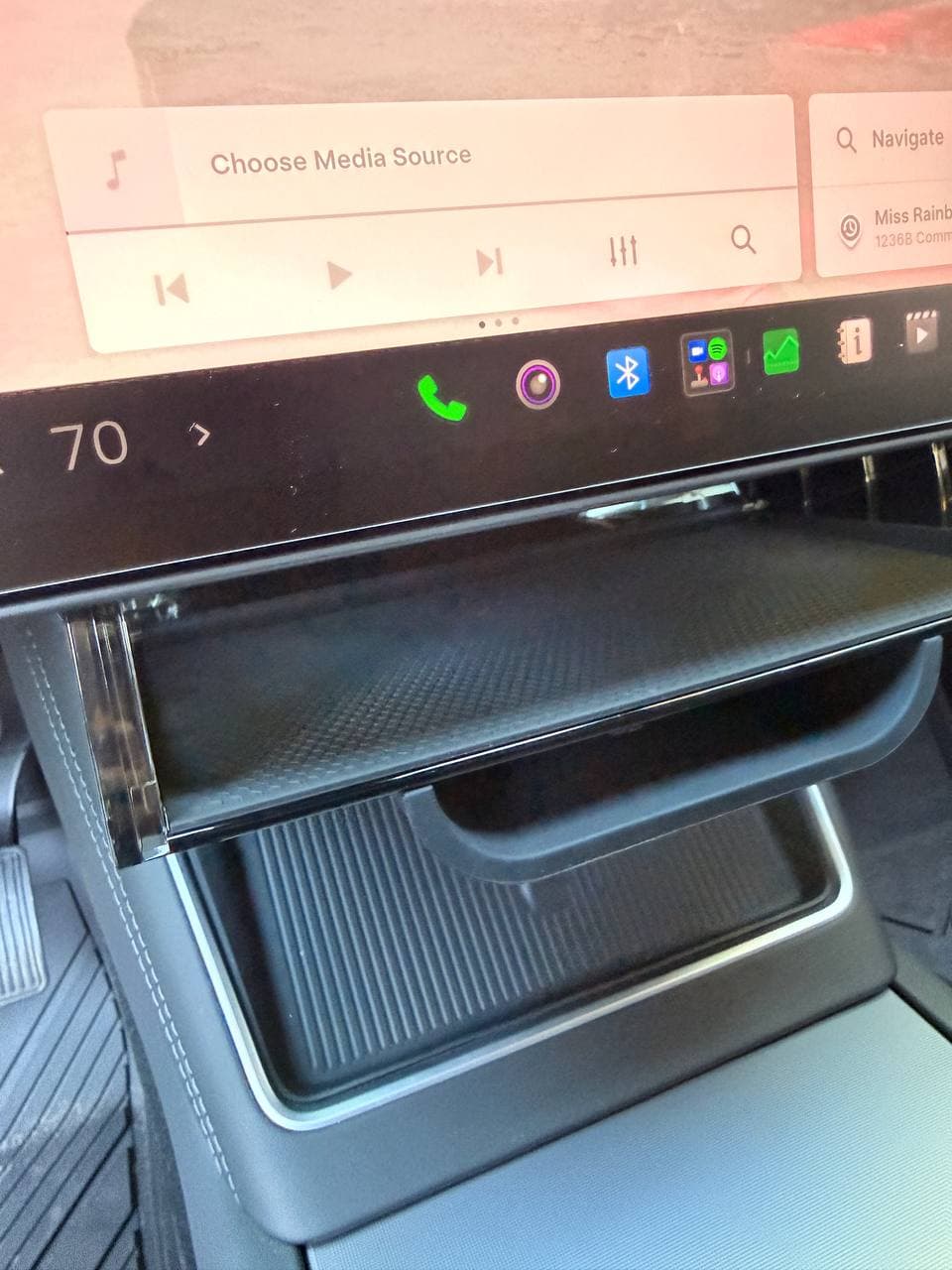 Foldable EVBASE under-screen tray installed below Tesla screen