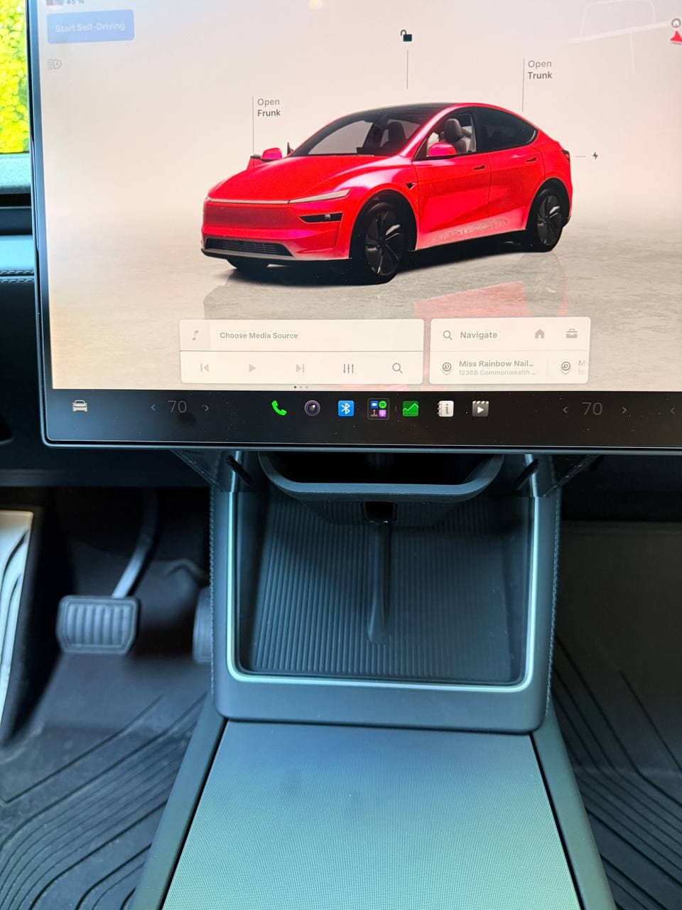 EVBASE foldable under-screen organizer folded away behind the Tesla screen