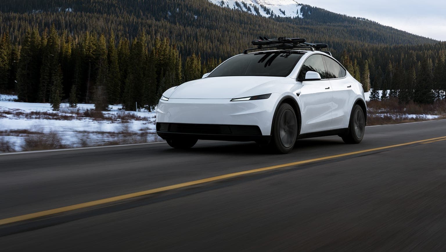 White Tesla Model Y Juniper driving on a road — suspension rattle guide