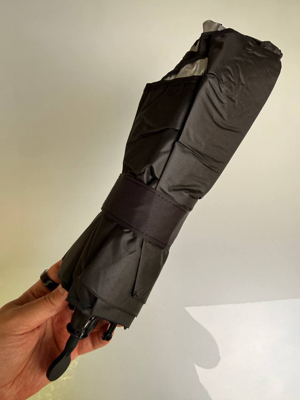 DooGooCoo windshield sunshade folded to compact umbrella size