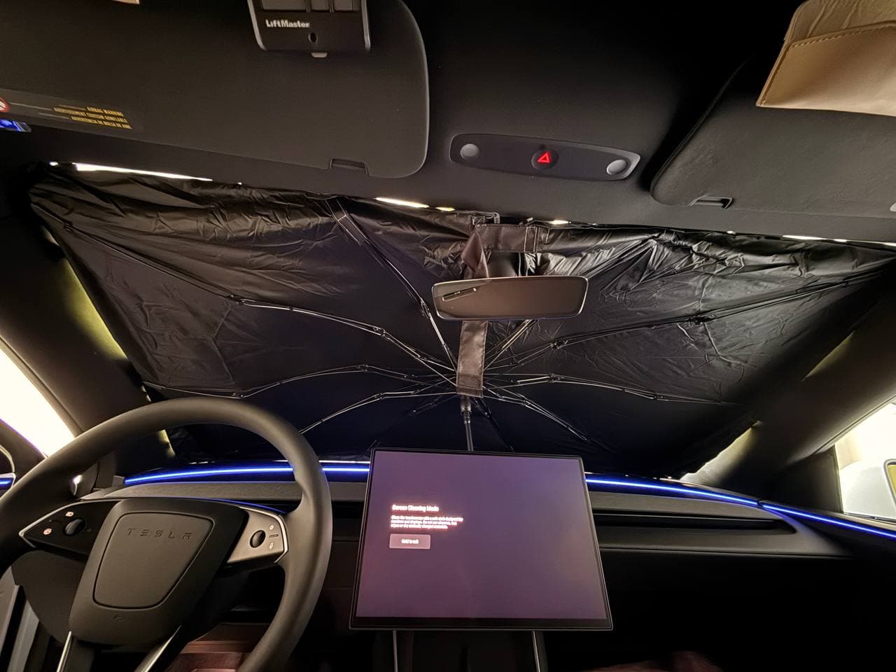 DooGooCoo windshield sunshade installed inside Tesla Model Y front windshield