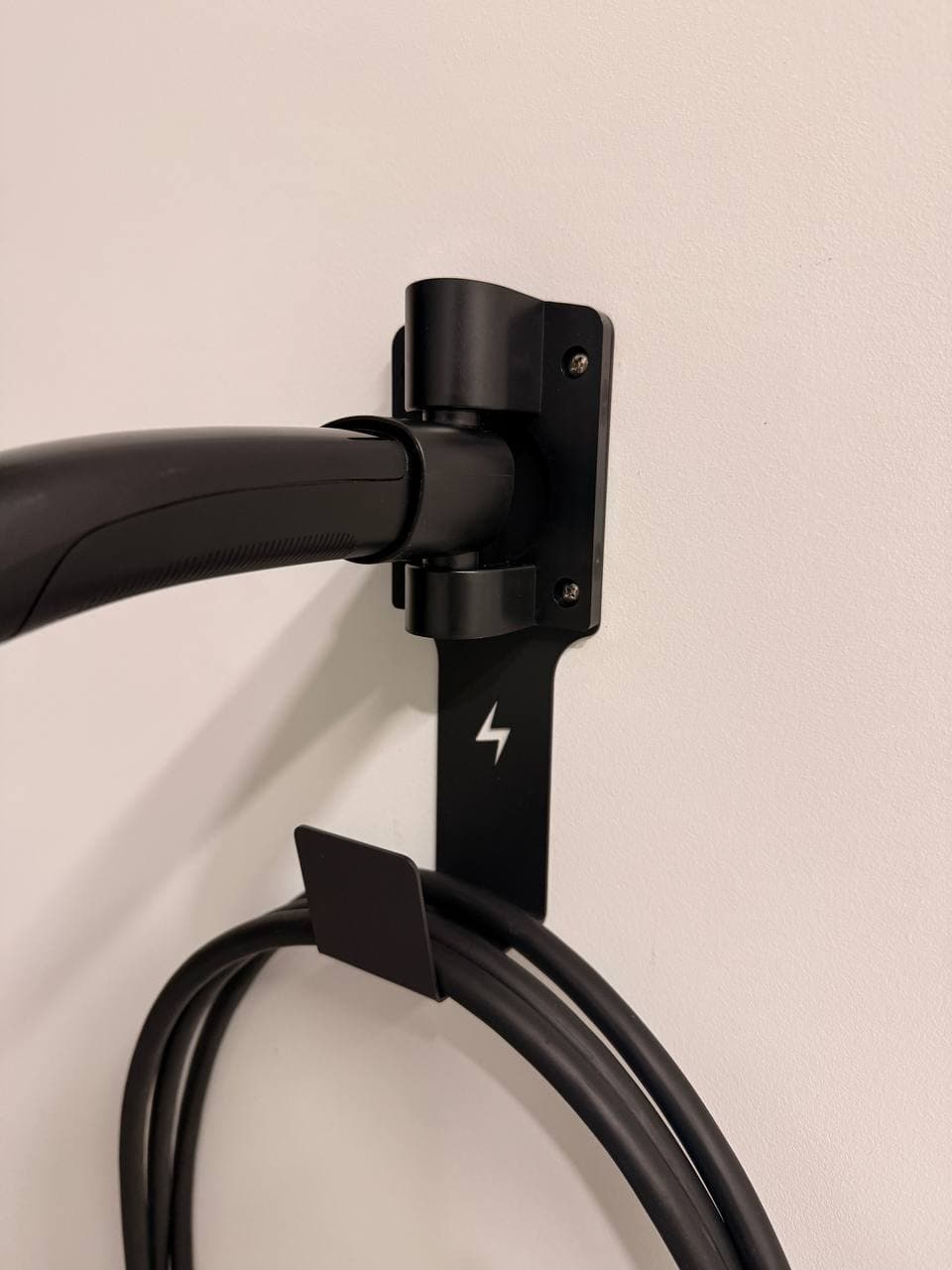 FOCSPROD Tesla charger holder with charge handle docked above the cable J-hook