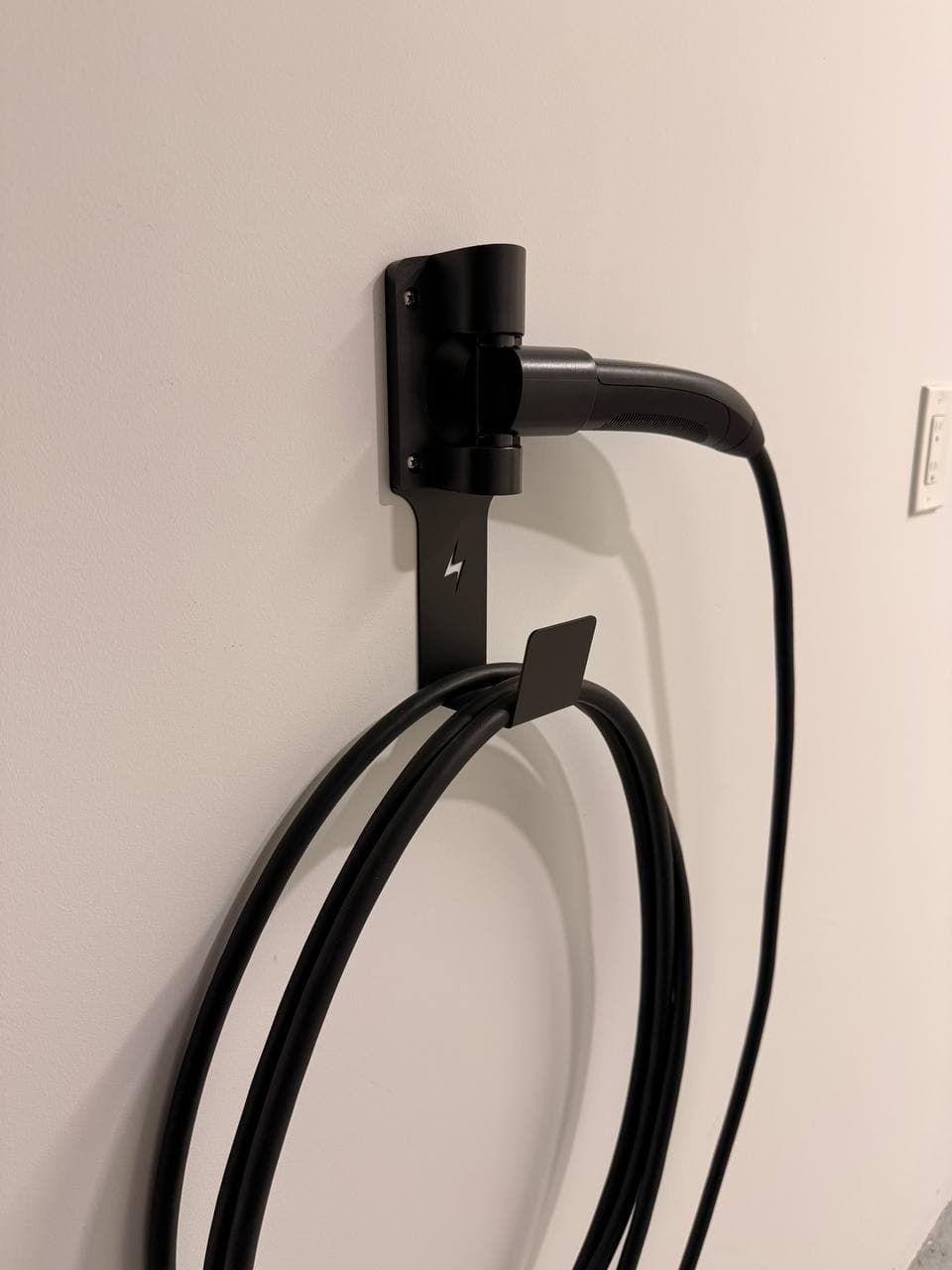 Tesla charge handle stored sideways in the FOCSPROD rotating nozzle dock