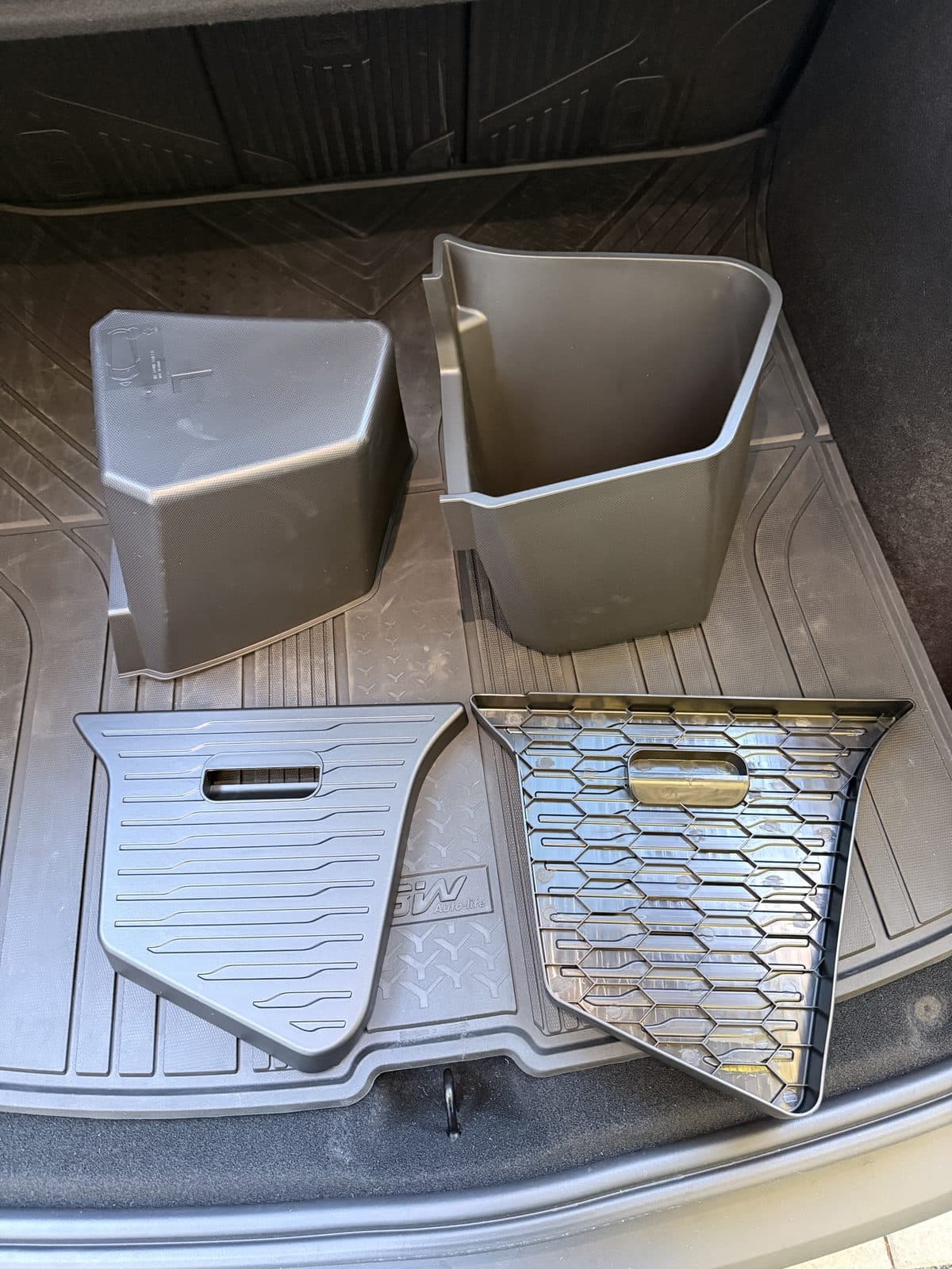 Yisuke trunk bin and lid, with one lid flipped to show the honeycomb ribbing underneath