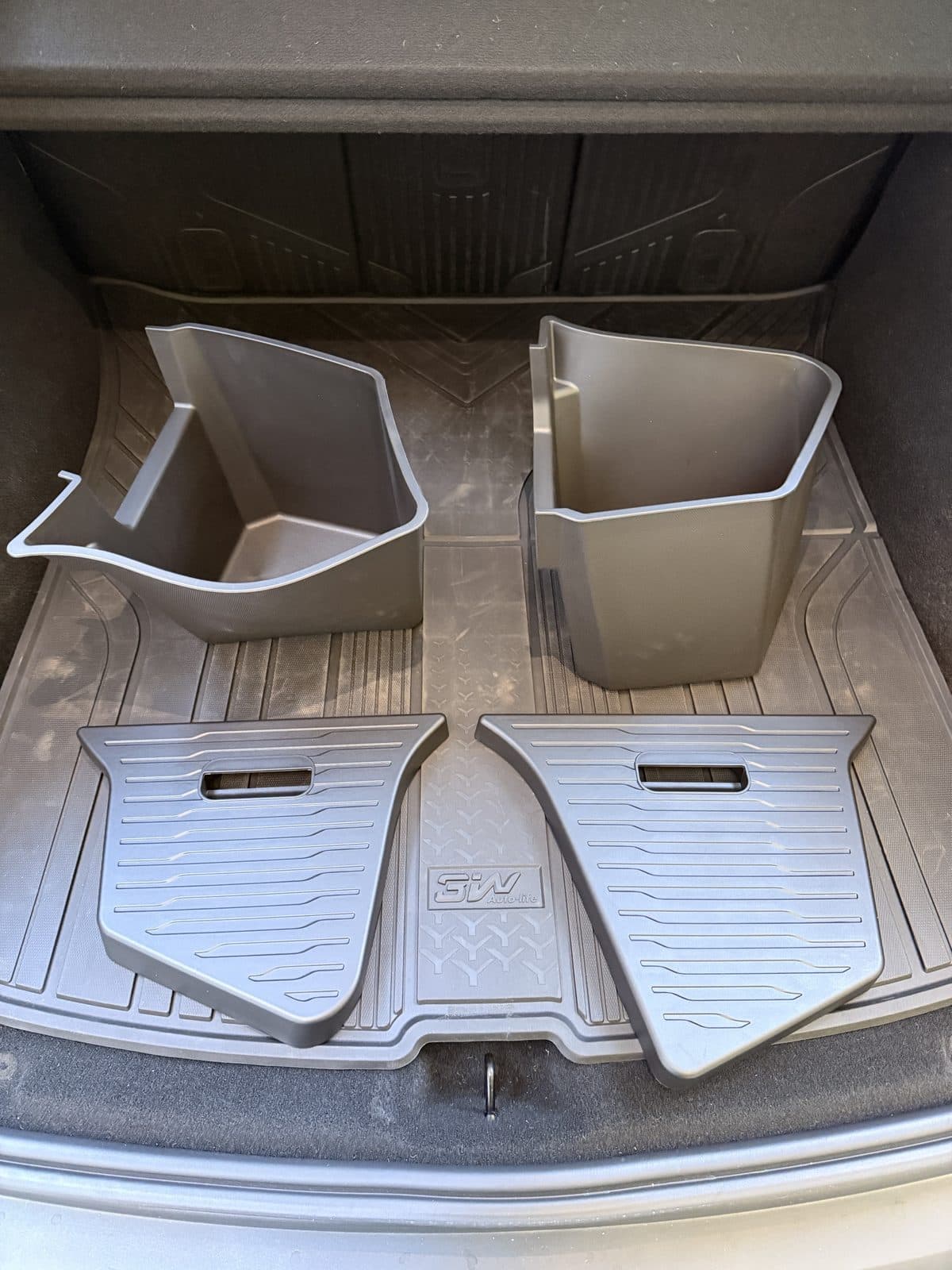 Yisuke left and right trunk storage bins with their two TPE lids on a Model Y Juniper trunk mat
